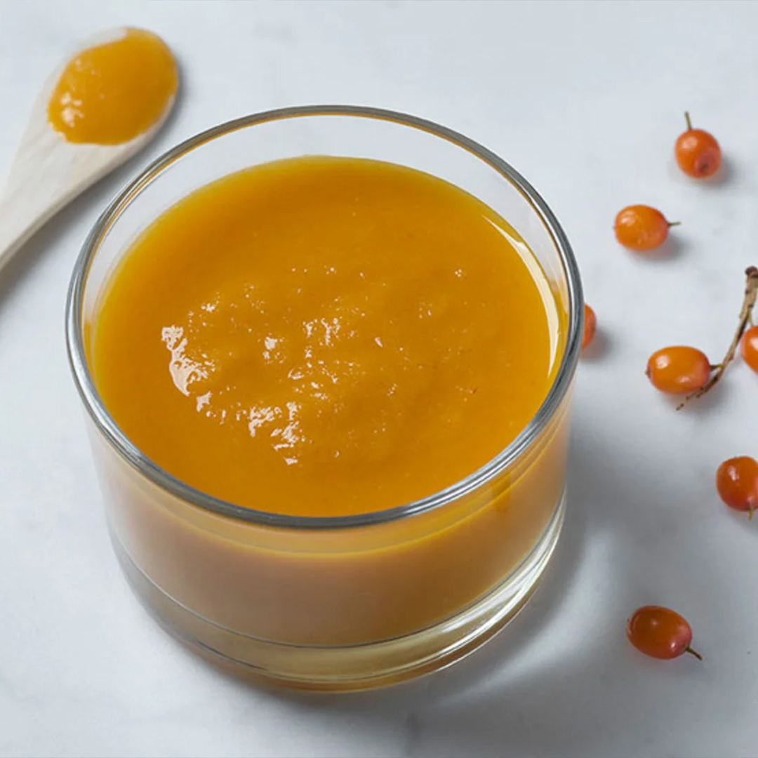 A small cup of pureed sea buckthorn