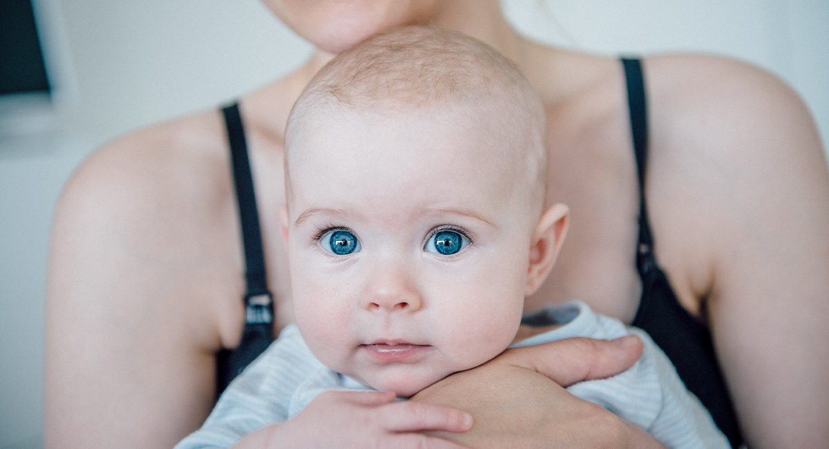 Banner baby in mothers arms